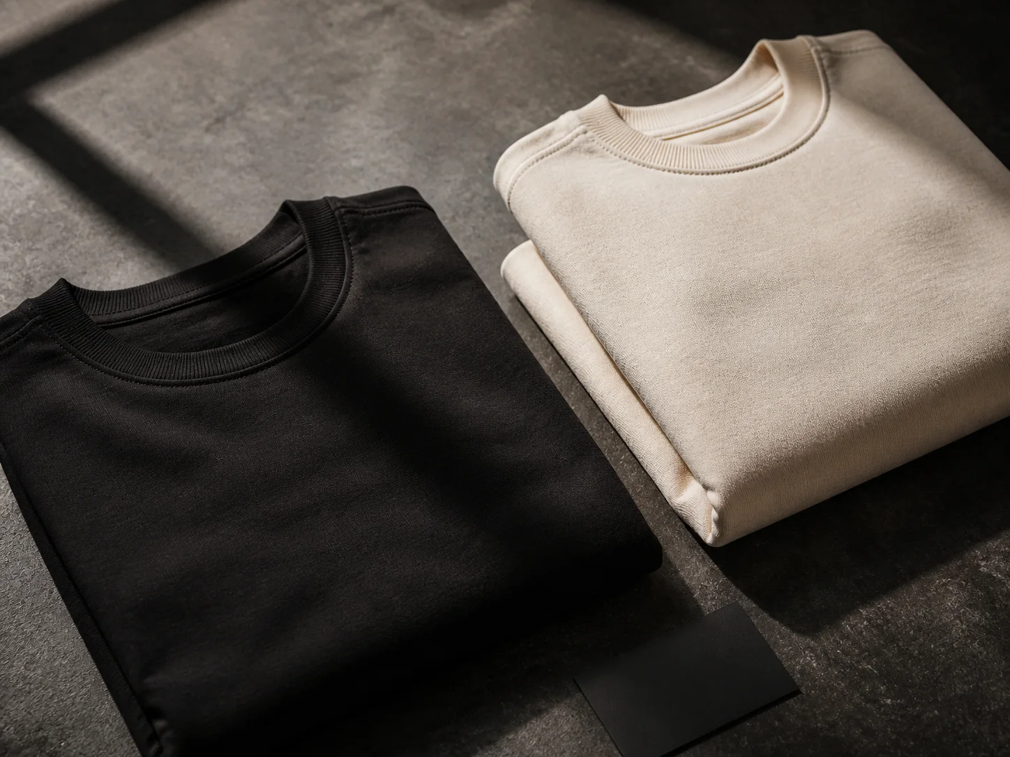 Washed-black and warm-bone heavyweight garments